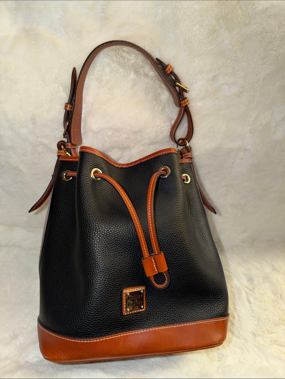 Dooney & Bourke Black Pebbled Leather Drawstring Bucket Bag with Brown Trim